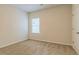 Simple bedroom with carpet flooring and neutral wall colors at 231 Orwell Dr, Social Circle, GA 30025