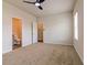 Bright bedroom with ceiling fan and access to a private bathroom at 231 Orwell Dr, Social Circle, GA 30025