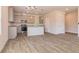 Open concept kitchen with gray cabinets, granite countertops, and stainless steel appliances at 231 Orwell Dr, Social Circle, GA 30025