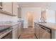 Kitchen with gray cabinets, granite countertops, and stainless steel appliances at 231 Orwell Dr, Social Circle, GA 30025