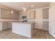Modern kitchen island with granite countertops and gray cabinets at 231 Orwell Dr, Social Circle, GA 30025