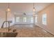 Open living room with hardwood floors, fireplace, and ceiling fan at 231 Orwell Dr, Social Circle, GA 30025