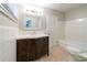 Clean bathroom with a vanity, toilet and bathtub at 4725 Dennis Spring Rd, Snellville, GA 30039