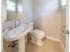 Clean bathroom with pedestal sink and tiled floor at 4725 Dennis Spring Rd, Snellville, GA 30039