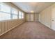 Spacious living area with wall-to-wall carpet and built-in shelving at 4725 Dennis Spring Rd, Snellville, GA 30039