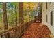 Deck and stairs leading to a wooded backyard with colorful autumn leaves at 230 Wessex Ct, Atlanta, GA 30328