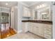 Large bathroom with granite countertops and off-white cabinets at 230 Wessex Ct, Atlanta, GA 30328