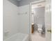 Clean bathroom with a tub, toilet and sink at 230 Wessex Ct, Atlanta, GA 30328