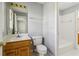 Bathroom with wood vanity, toilet and view of tub at 230 Wessex Ct, Atlanta, GA 30328