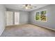 Bedroom with ceiling fan and access to bathroom at 230 Wessex Ct, Atlanta, GA 30328