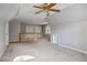 Bonus room with vaulted ceiling, ceiling fan and hardwood floors at 230 Wessex Ct, Atlanta, GA 30328