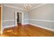Formal dining room with hardwood floors and chandelier at 230 Wessex Ct, Atlanta, GA 30328