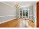 Bright dining room features hardwood floors, a chandelier, and built-in shelving at 230 Wessex Ct, Atlanta, GA 30328