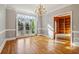 Spacious dining room with hardwood floors, large windows, and access to a study at 230 Wessex Ct, Atlanta, GA 30328