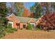 Brick house with a large front yard and mature trees at 230 Wessex Ct, Atlanta, GA 30328