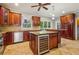 Kitchen boasts granite countertops, wood cabinets, and an island with wine cooler at 230 Wessex Ct, Atlanta, GA 30328