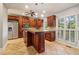 Spacious kitchen with granite island, stainless steel appliances, and wood cabinets at 230 Wessex Ct, Atlanta, GA 30328