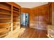 Study with wood paneling, built-in bookshelves, and access to other rooms at 230 Wessex Ct, Atlanta, GA 30328