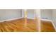 Bright living room with hardwood floors and access to other rooms at 230 Wessex Ct, Atlanta, GA 30328