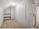 Unfinished storage room with shelving and carpeted floor at 230 Wessex Ct, Atlanta, GA 30328