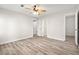 Bright bedroom with ceiling fan and hardwood floors at 1095 Woodington Cir, Lawrenceville, GA 30044