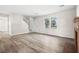 Living room with hardwood floors, fireplace, and staircase at 1095 Woodington Cir, Lawrenceville, GA 30044