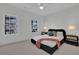 Cozy bedroom with a queen bed, soft color scheme, and two windows at 4814 Moonview Ln, Sugar Hill, GA 30518