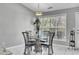 Bright dining area with a glass table and four chairs at 4227 Cedar Lake Dr, Conley, GA 30288