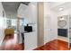 Entryway with built-in desk, hardwood floors, and a view into a modern bathroom at 3324 Peachtree Ne Rd # 1813, Atlanta, GA 30326