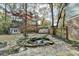 Landscaped backyard with pond, stone pathway and shed at 3142 Falconhurst Dr, Lilburn, GA 30047