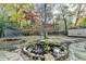 Serene backyard oasis with pond feature and trampoline at 3142 Falconhurst Dr, Lilburn, GA 30047