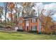 Brick two-story house with a landscaped lawn and trees at 4741 Summerwood Se Dr, Smyrna, GA 30126