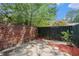 Small private backyard with brick wall and wooden fence at 3075 Colonial Way # M, Atlanta, GA 30341