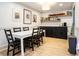 Dining area with white table, black chairs, and built-in shelving at 3135 Seven Pines Ct # 101, Atlanta, GA 30339