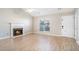 Living room with hardwood floors, fireplace and plenty of natural light at 547 Brenston Ct, Ellenwood, GA 30294