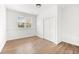 Simple bedroom with wood floors and double door closet at 3142 Chamblee Gap Rd, Cumming, GA 30040