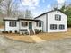 Newly renovated two-story home with a white exterior and gray trim at 3142 Chamblee Gap Rd, Cumming, GA 30040