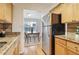 Kitchen with stainless steel appliances and view into dining area at 1150 Collier Nw Rd # E5, Atlanta, GA 30318