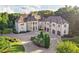 Grand estate with a long driveway and manicured lawns at 1513 Jones Rd, Roswell, GA 30075