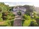 Luxury home with extensive landscaping and a large circular driveway at 1513 Jones Rd, Roswell, GA 30075