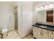 Clean bathroom with granite vanity and a walk-in shower at 1513 Jones Rd, Roswell, GA 30075