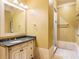 Well-lit bathroom with granite vanity and walk-in shower at 1513 Jones Rd, Roswell, GA 30075