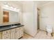Elegant bathroom with granite vanity and a walk-in shower at 1513 Jones Rd, Roswell, GA 30075