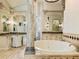 Bathroom with large soaking tub and and vanities at 1513 Jones Rd, Roswell, GA 30075