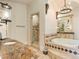 Luxurious bathroom with soaking tub, walk-in shower, and granite countertops at 1513 Jones Rd, Roswell, GA 30075