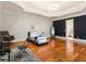 Charming bedroom with hardwood floors and a drum set at 1513 Jones Rd, Roswell, GA 30075