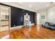 Bright bedroom with hardwood floors and built-in workspace at 1513 Jones Rd, Roswell, GA 30075