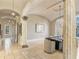 Elegant dining room with arched entryways and a large chandelier at 1513 Jones Rd, Roswell, GA 30075