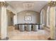 Formal dining room with a dark wood table, gray chairs, and arched windows at 1513 Jones Rd, Roswell, GA 30075