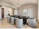 Bright dining room with a long table and a large globe chandelier at 1513 Jones Rd, Roswell, GA 30075